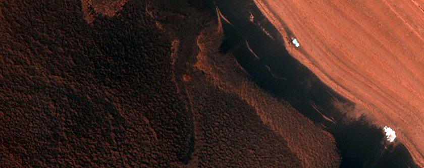 Steep North-Polar Boundary Scarp Mass Wasting