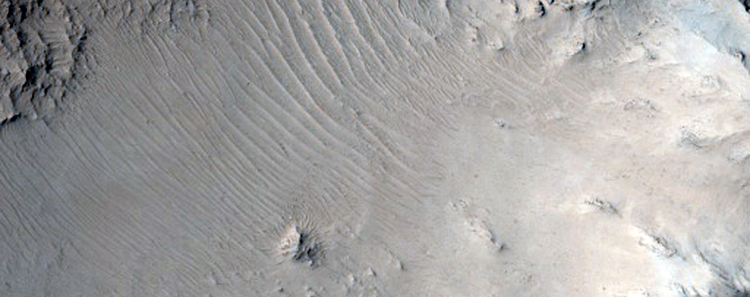 Central Peak of Well-Preserved Crater Northwest of Tartarus Montes