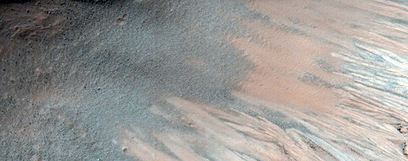 Impact Crater Exposing Stratigraphy in Eos Chasma