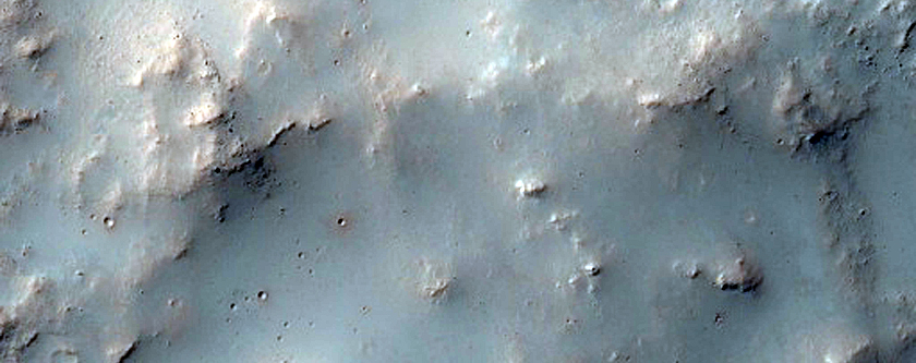 Small Crater on Floor of Huygens Crater with Possible Phyllosilicates