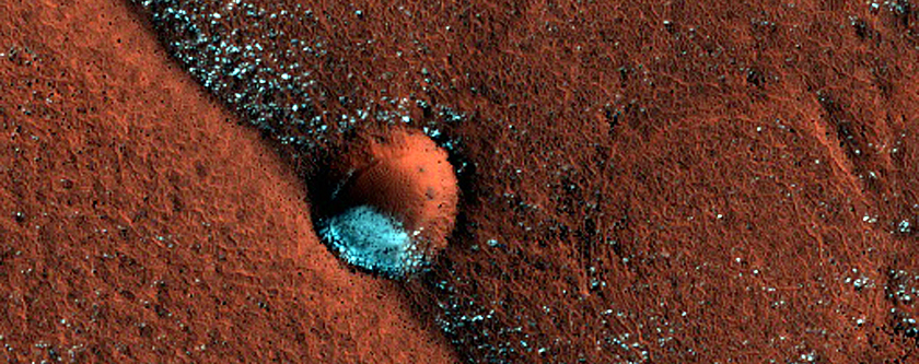 Small Crater and Arcuate Ridge West of Olympia Mensae