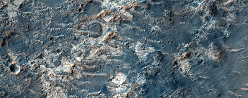 Phyllosilicate Bearing Dark Deposit in Crater on Margaritifer Terra