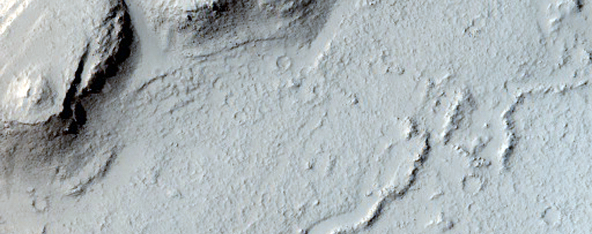 Layered Rocks and Scarp on Crater Floor