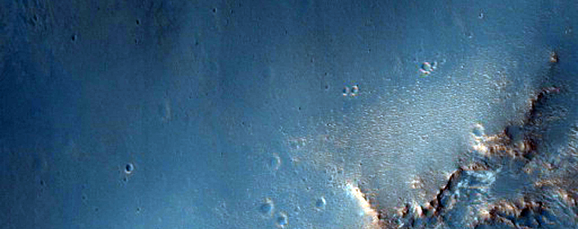 Light-Toned Rock Outcrop Exposed by Crater South of Oyama Crater