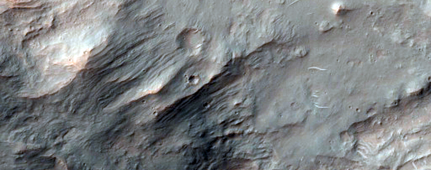Impact Crater Exposing Bedrock in Thaumasia Planum