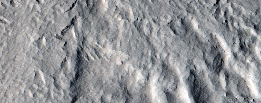 Complex Pedestal Crater on Ejecta Blanket of Larger Crater