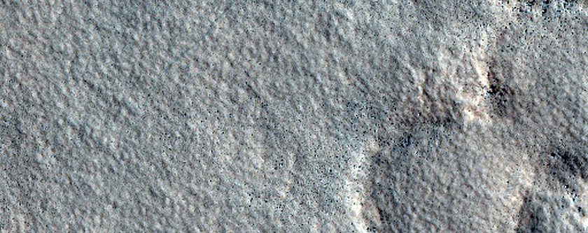 Possible Phyllosilicate-Rich Terrain in Stokes Crater
