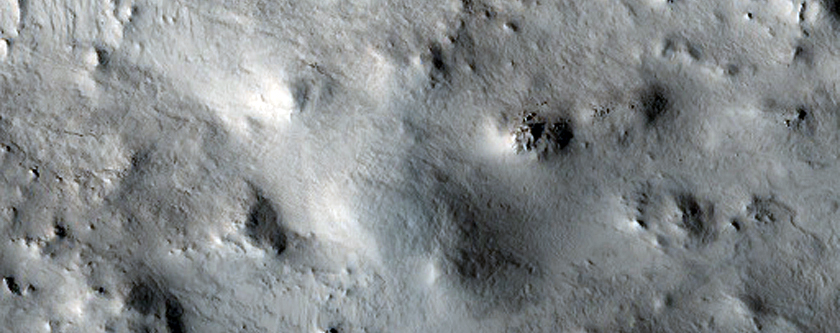 Central Uplift of a Crater near Dichotomy Boundary