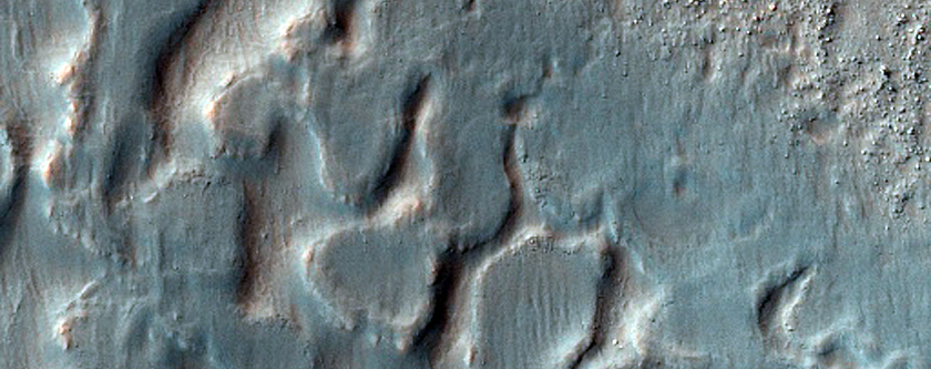 Crater Floor Material and Rounded Mesas