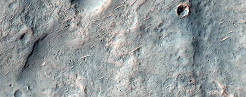 Crater Ejecta Overlapping Filled Crater