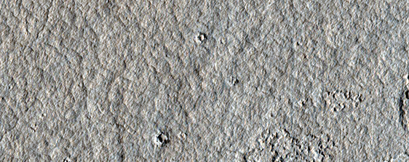 Decameter-Scale Patterned Ground and Possible Pits