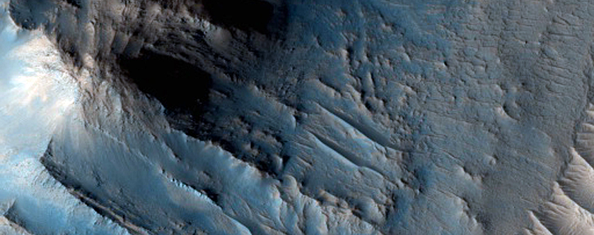 Well-Preserved Impact Crater with Central Uplift and Glacial Flow Features