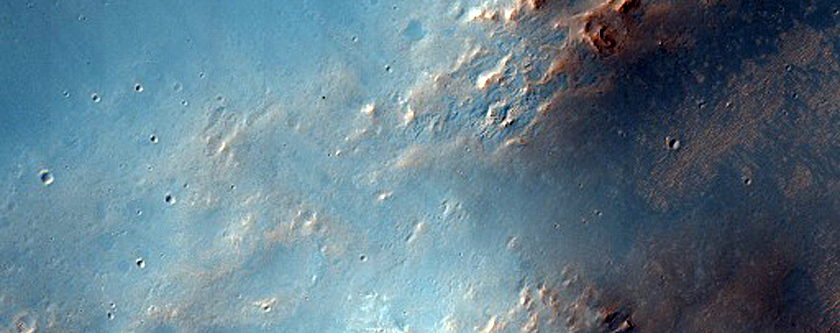 Possible Phyllosilicate-Rich Terrain in Ejecta of Crater on Huygens Crater