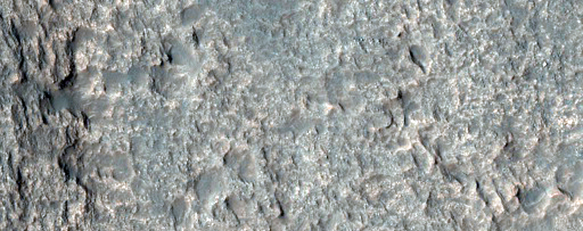 Pits Exposing Layered Bedrock