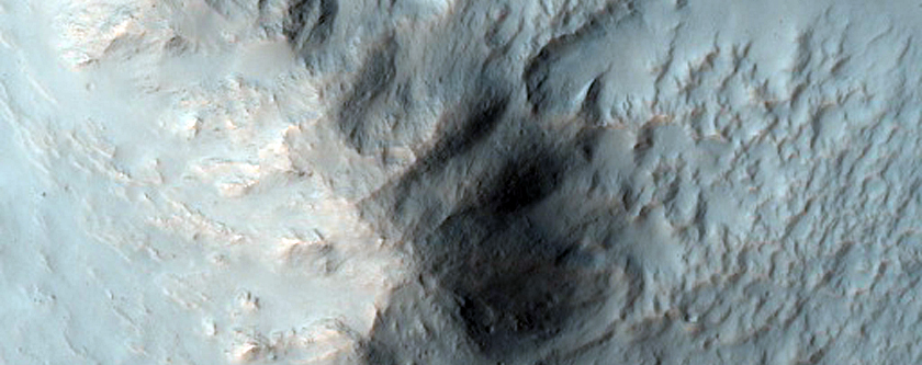 Well-Preserved Crater with Gullies and Bedrock Exposures