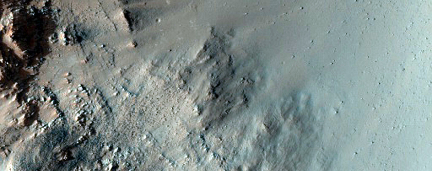 Crater on Floor of Huygens Crater with Possible Olivine