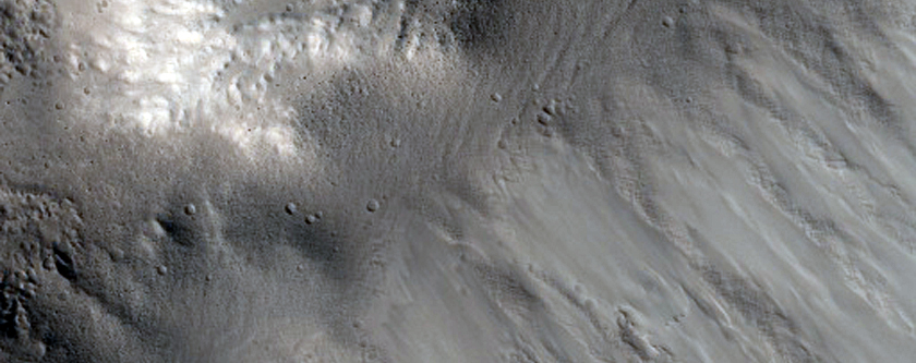 Well-Preserved Impact Crater on Phlegethon Catena