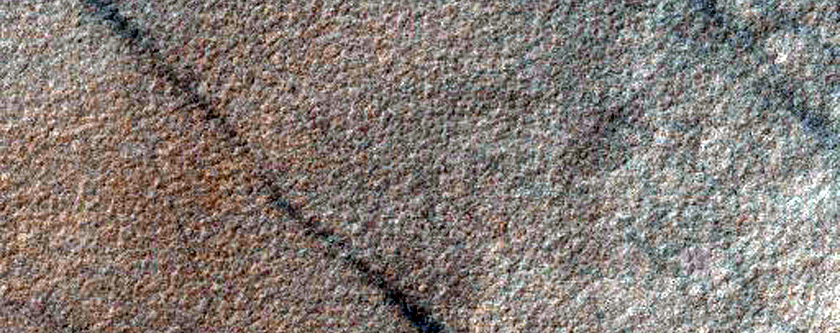 Disaggregated Polygons on Northern Rim and Interior of Crater