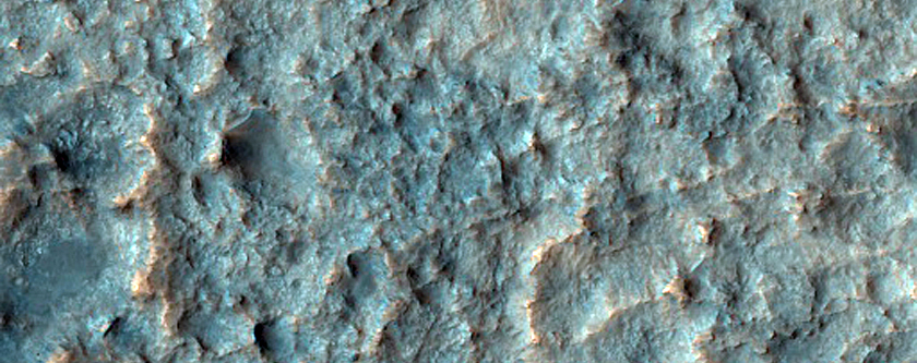 Edge of Rocky Deposit on Filled Floor of Large Old Crater
