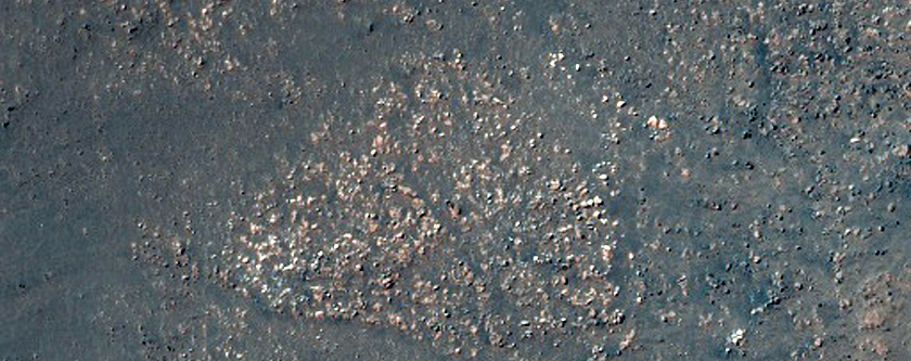 Central Structure in an Impact Crater with Bedrock Exposures