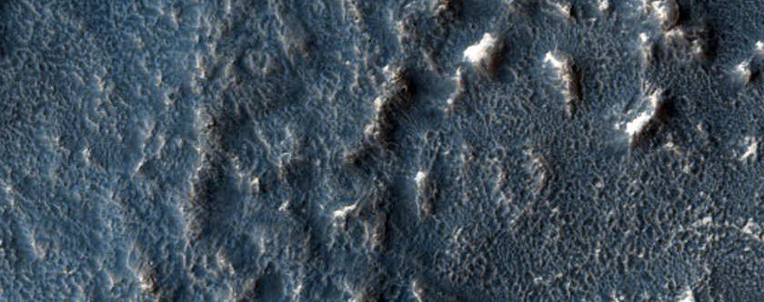 Tilted Layers in Crater Deposit in Hellas Montes Region