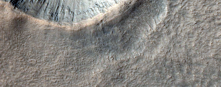 Well-Preserved 1-Kilometer Diameter Impact Crater near Reull Vallis