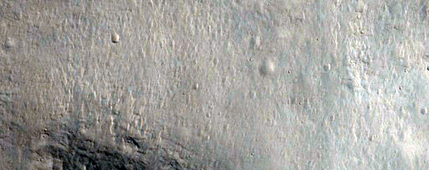 Well-Preserved 12-Kilometer Impact Crater on East Rim in Isidis Region
