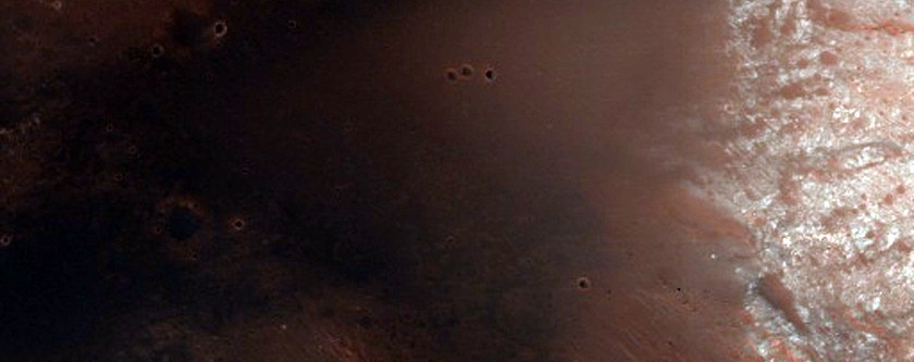 Bedrock Exposed in Walls of 30-Kilometer Impact Crater