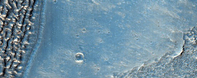 Valley Containing Lineated Fill Materal in Coracis Fossae Region
