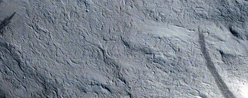 Layers in Pedestal Crater within Tikhonravov Crater