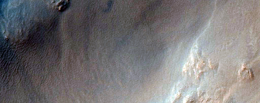 Crater with Central Peak Exposing Bedrock