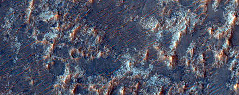 Olivine and HCP Signatures on Floor of Filled Crater West of Huygens Crater