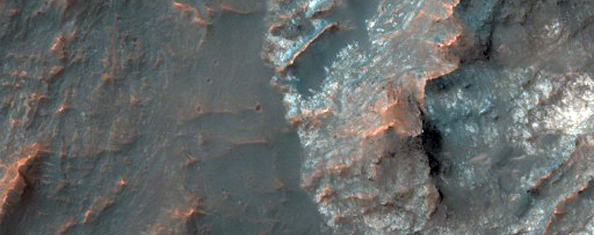 Central Pit of an Impact Crater with Layered Bedrock