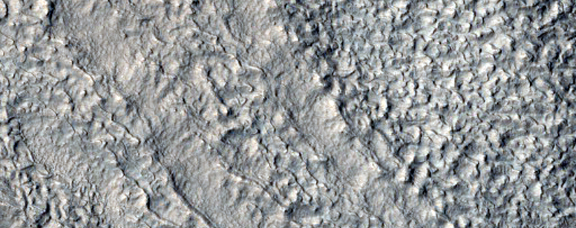 Layered Deposits in Crater in Hellas Montes Region