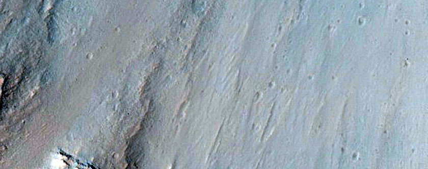 Possible Hydrate-Rich Terrain in Geryon Montes Wallrock in Ius Chasma