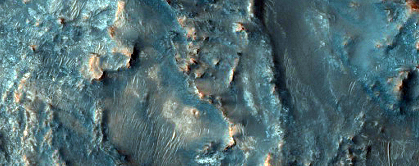 Possible Mafic and Carbonate-Rich Terrain in Northeast Syrtis Region Basin