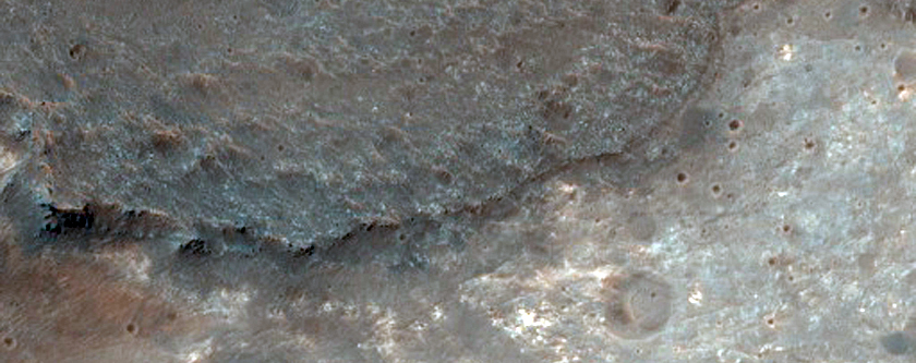 Light-Toned Phyllosilicates along Plains at Coprates Catena