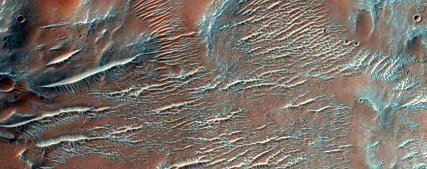 Possible Phyllosilicates in Small Crater Northeast of Nirgal Vallis