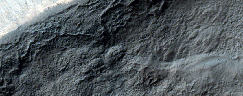 Possible Olivine-Rich Pedestral Crater Wall in Terra Sirenum