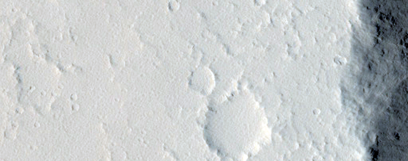 Cross-Cutting Wrinkle Ridge and Graben in Nilus Chaos