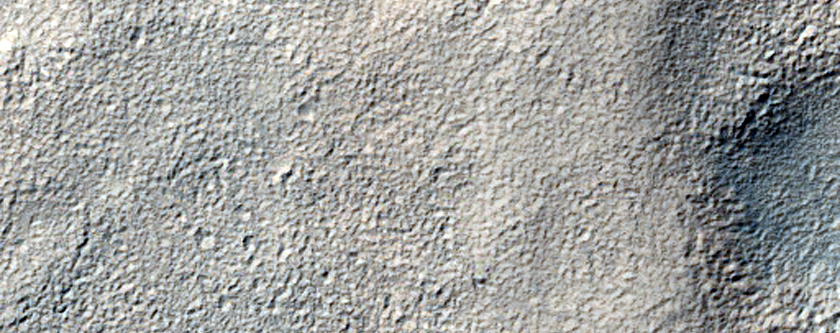 Layered Deposit in Small Crater East of Hellas Region