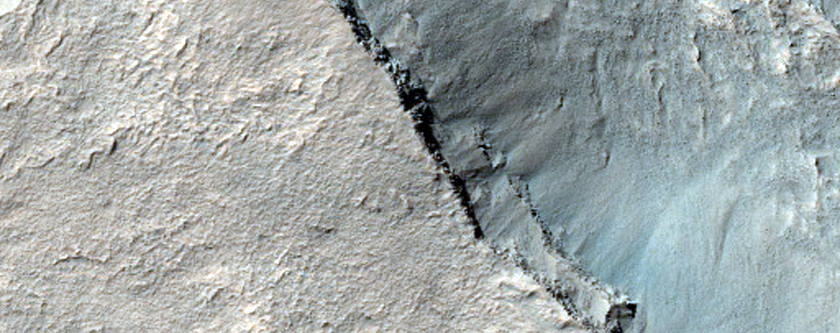 Pit in Crater Floor with Exposed Layers