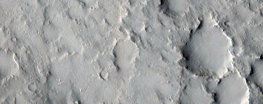 Crater Ejecta Blanket in Contact with Previous Small Crater