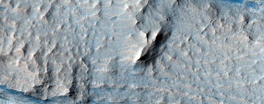 Layered Deposits in Crommlin Crater with Eroded Troughs