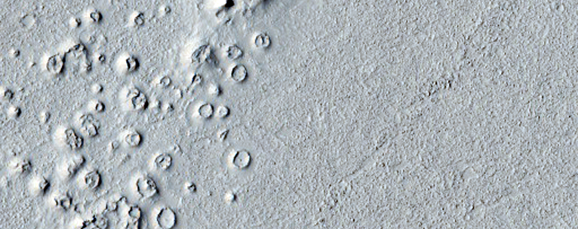 Small Cones/Mounds in Channel Cutting Secondary Craters of Zunil Crater