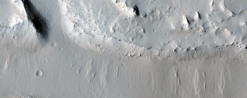 Scoured and Troughed Area Northwest of Jovis Tholus
