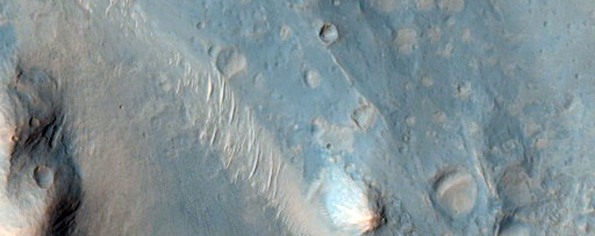 Dark Central Uplift in an Unnamed Crater in Hesperium Planum