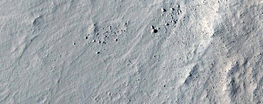 Crater and Extensive Field of Secondary Craters Seen in MOC Image R15-02146