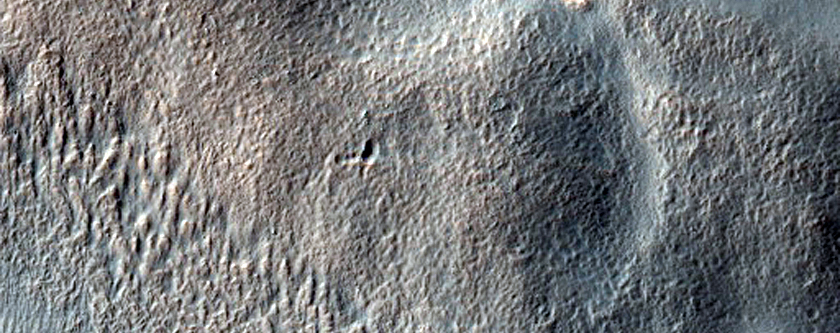 Valley Intersecting Crater in the Hellas Montes Region 