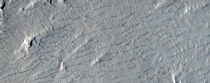 Dark Materials on Block in Olympus Mons Aureole 